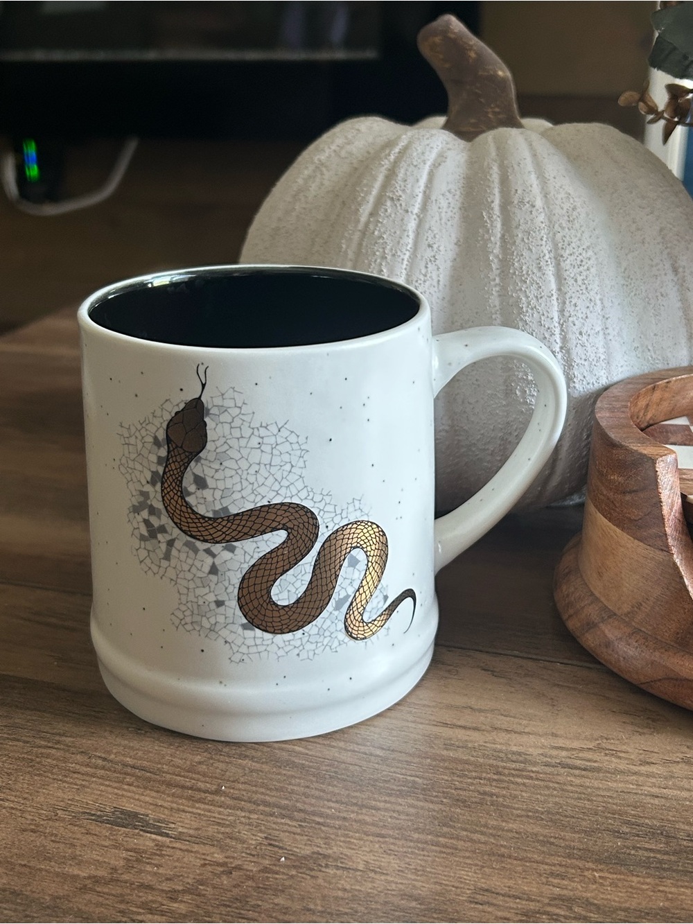 Gold snake mug with black interior